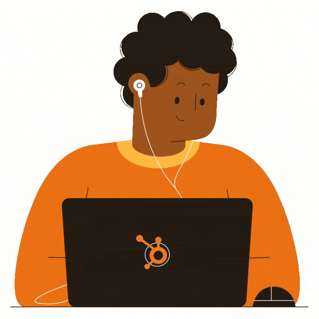 Person with headphones in coding at their laptop
